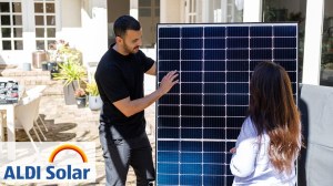 Man and woman looking at solar panel